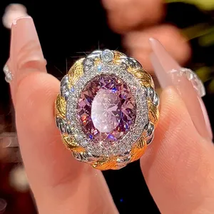 Close-up detail of vintage style woven ring with oval pink center stone and sparkling halo.