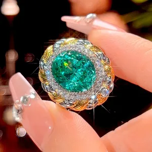 Luxury vintage oval green gemstone ring with twisted metal and sparkling rhinestone accents.