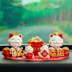 Cute lucky cat car dashboard ornament set, resin feng shui wealth figurine for auto decor.