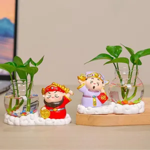 Ornement de plante verte de bureau de vase en verre hydroponique de dieu de fortune en résine.
