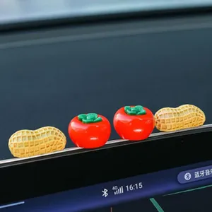 Cute mini car dashboard ornaments, resin peanut and tomato creative auto interior decor details.