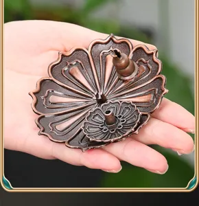 Detail view of vintage bronze lotus incense burner holder with gourd insert for home aromatherapy.
