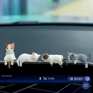 Cute cat figurines car dashboard decoration, creative interior accessory for vehicle display.