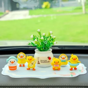 Süße gelbe Enten Auto Armaturenbrett Dekoration Set mit Anti-Rutsch-Matte und Topfpflanze.
