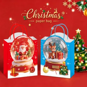 Details of the Christmas paper bag featuring cute Santa and reindeer snowglobe prints.