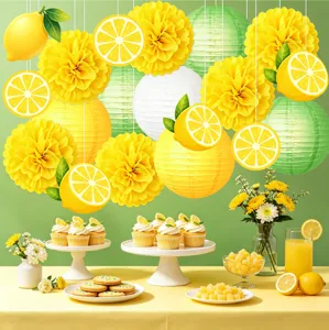 Lemon theme party decoration scene detail view, showing hanging lanterns and paper flower poms.