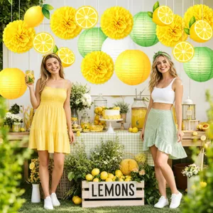 Lemon theme party decoration set with paper pom poms lanterns and hanging swirls for birthday.