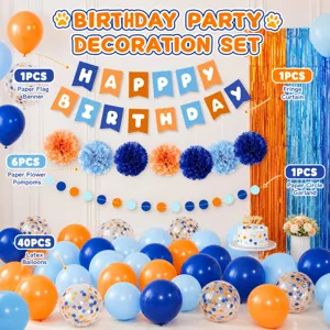 Blue and orange birthday party decoration set with balloons, banner, and paper pom poms.