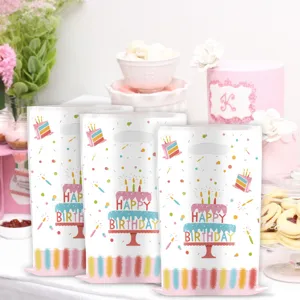 Birthday party plastic gift bags with colorful cake and confetti print for party favors.