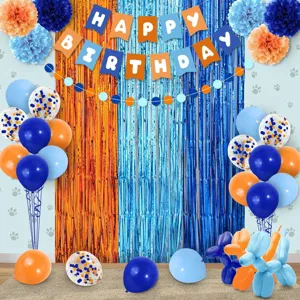 Blue and orange birthday party decoration set with fringe curtains, banner and balloons.