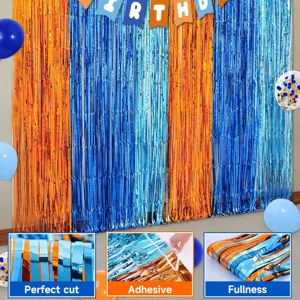 Blue and orange foil fringe curtain backdrop for birthday party decorations and photo booth.