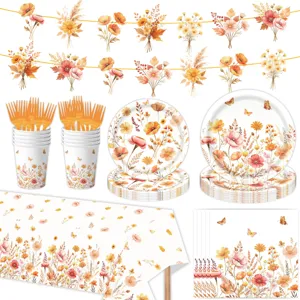 Set di stoviglie per festa autunnale con piatti di carta, bicchieri, tovaglioli e nappe.