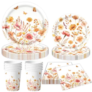 Set di stoviglie per feste con fiori autunnali con piatti, bicchieri e tovaglioli.