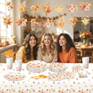 Set di stoviglie per feste con fiori autunnali di carta, bicchieri, tovaglioli e banner.