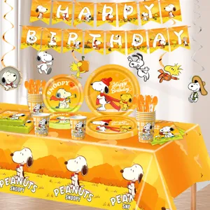 Snoopy theme birthday party supplies set with paper plates cups tablecloth and hanging banners.