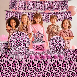 Pink leopard print birthday party detail showing plates, cups, banner, and cute table setup.