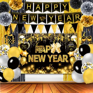 Details of black and gold New Year party decoration backdrop set for festive holiday events.