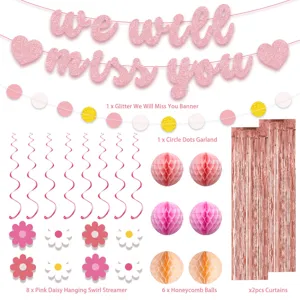 Detailed view of pink party decoration set, including glitter banner, honeycomb balls, and swirls.