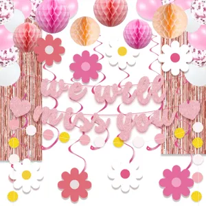 Pink retirement party decorations banner daisy hanging swirls and balloons for celebration.