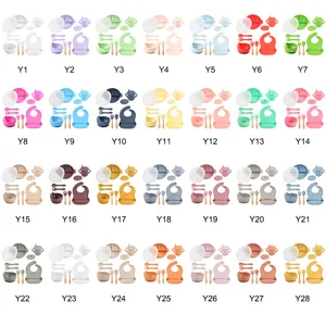 Silicone baby feeding set with divided plate, bowl, cup, bib, and wood spoons, varieties.
