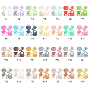 Silicone baby feeding set with divided plates, bowls, cups, bibs, and spoons in 28 vibrant colors.