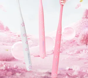 Close-up of adult deep cleaning toothbrush detail, soft bristles, cherry blossom handle design.