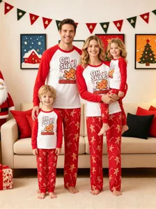 Family matching Christmas pajamas detail featuring gingerbread print and cozy long sleeve top design.