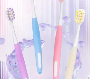 Soft bristle toothbrushes in pastel colors, featuring dense filaments and comfortable handle grips.