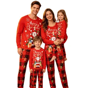 Family Christmas matching pajama set with long sleeve Santa print tops and plaid pants.