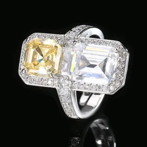 Prachtige ring met dubbele hoofdsteen en gele en witte zirkonia's met pavéband.