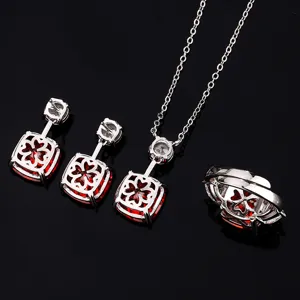 Detail view of the elegant vintage red stone jewelry set featuring necklace, earrings and ring.