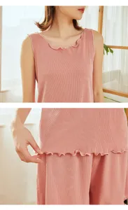 Pink ribbed cotton loungewear set detail, lettuce trim sleeveless top and shorts closeup.