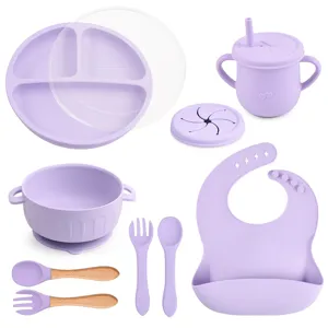 Baby silicone feeding set 9pcs, divided suction plate, bowl, cup, bib, and spoons for toddlers.
