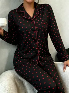 Women's black and red heart print long sleeve pajama set with lapel collar and buttons.