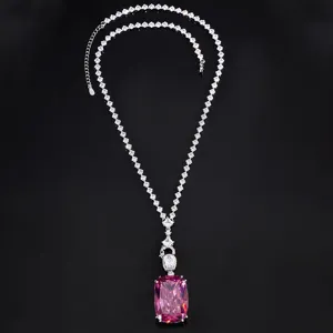 Close-up detail of the luxury large pink crystal pendant necklace with shimmering rhinestones.