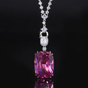Luxury pink crystal pendant necklace detail shot, sparkling brilliant cubic zirconia accents.