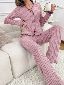 Women pink ribbed long sleeve cardigan pajama set comfortable casual loungewear for winter.