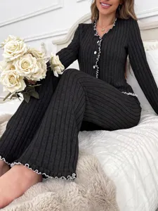 Women's black ribbed long sleeve button up pajama set with lettuce trim detail detail view
