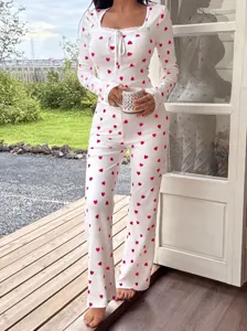 Modische Damen rosa Herz Print Rippstrick Hausanzug Langarm Oberteil und bequeme lange Hose