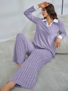 Detail view of the women solid color ribbed pajama set featuring contrast white collar and cuffs.