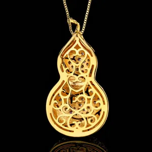Exquisite gold-plated hollow gourd pendant necklace detailed close-up shot luxury jewelry accessory