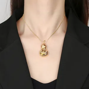 Gold diamond-encrusted gourd pendant necklace detail view, elegant jewelry accessory design.