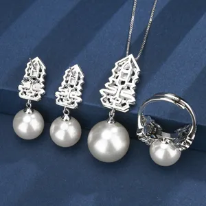 Detail view of the elegant pearl jewelry set featuring Christmas tree design and white pearls.