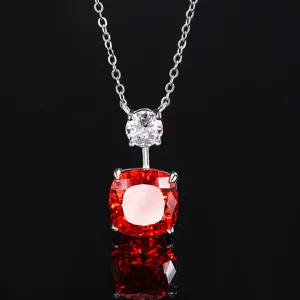 Stunning orange-red cushion cut gemstone necklace with sparkling round cubic zirconia pendant.