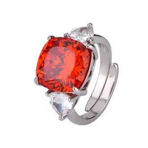 Stunning orange cushion-cut gemstone silver adjustable ring with sparkling side stones.