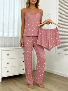 Detail shot of women pink heart print 3-piece pajama set featuring lace camisole and pants.