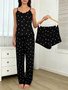 Detailed shot of women's black heart print 3-piece pajama set featuring lace camisole.