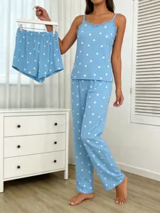 Detail view of light blue 3-piece pajama set with white heart print and lace camisole.