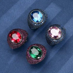 Chunky oval simulation gemstone ring with micro-pave stones, bold black gold design.