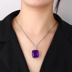 Stunning cushion-cut purple gemstone pendant necklace with delicate silver chain, elegant jewelry.